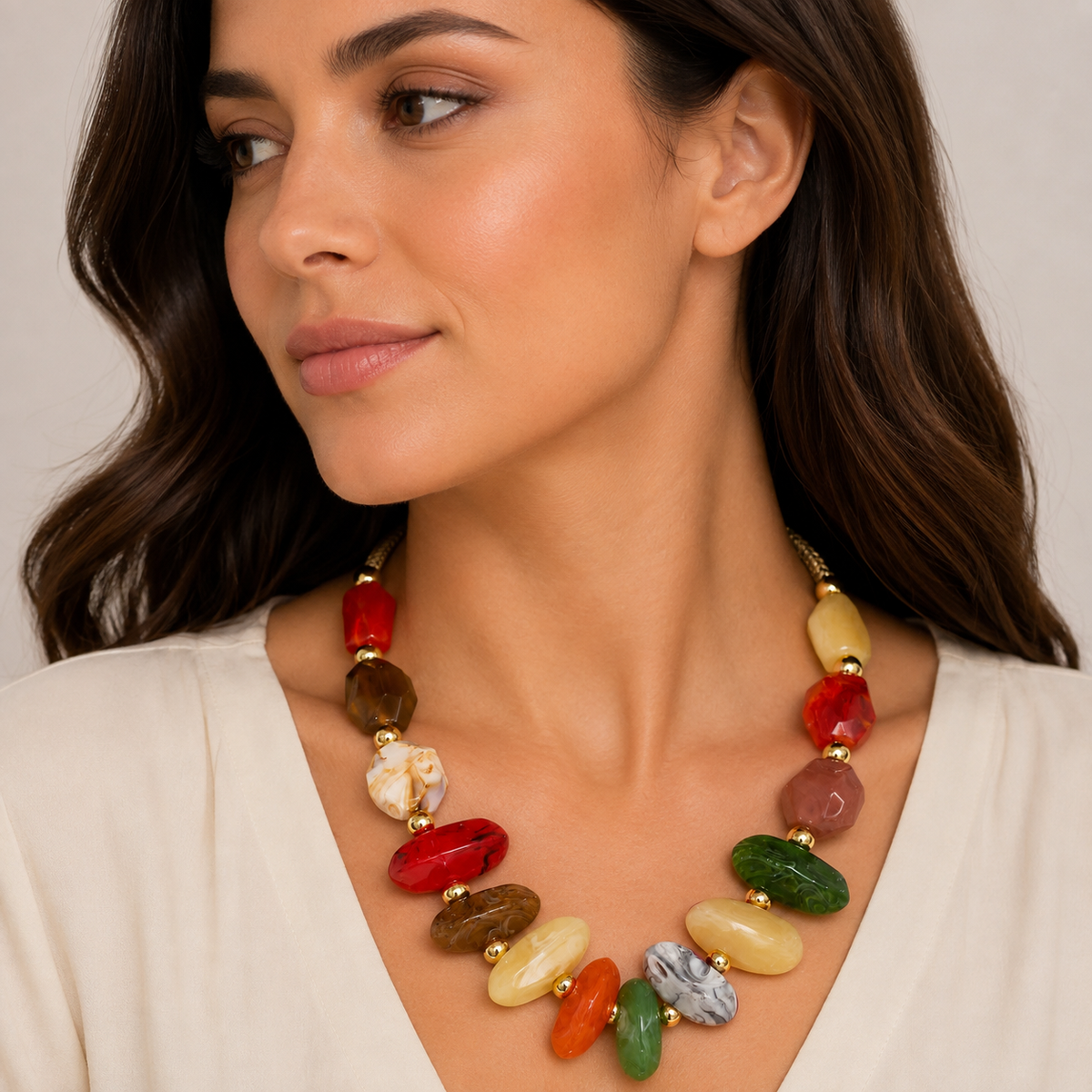 Multicolor gemstone necklace with gold accents.