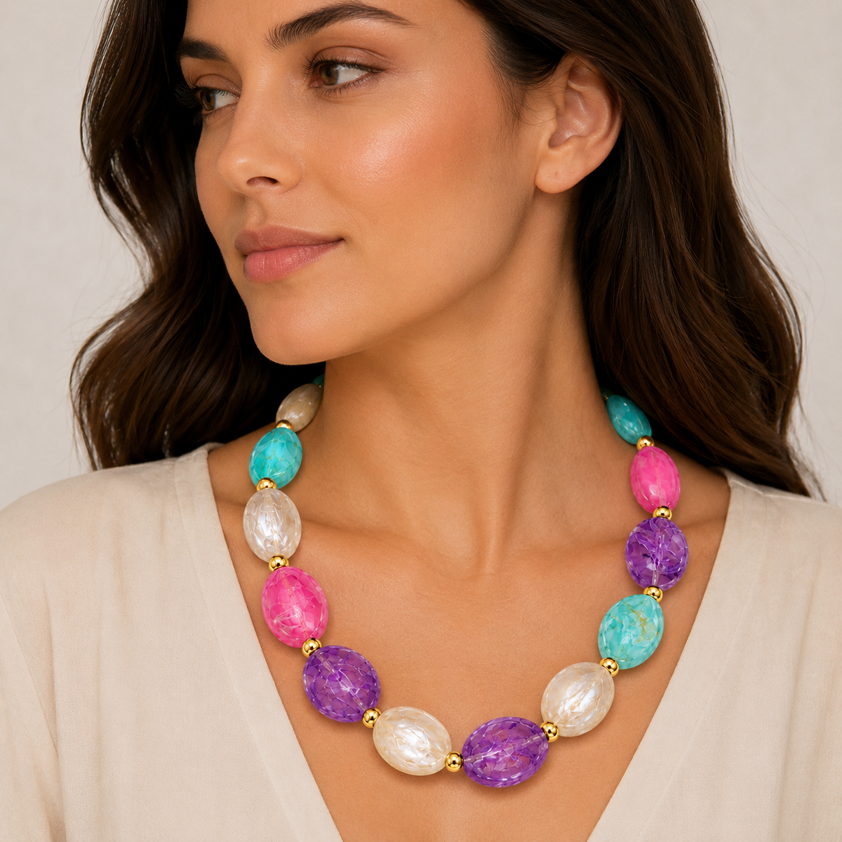 Colorful gemstone necklace with gold accents.